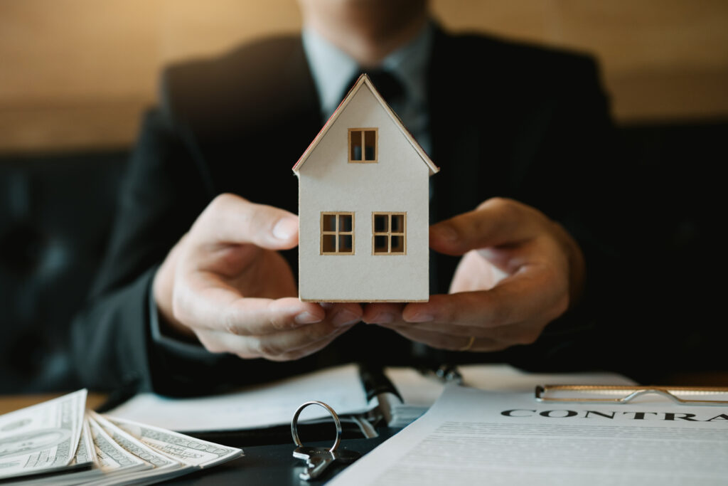Photo of a house in hands