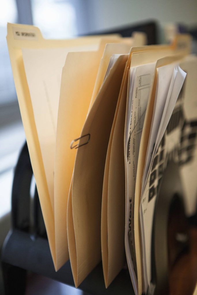 close up of inbox row of files on office desk 2024 06 06 01 15 34 utc
